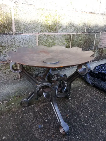 Fire dish. Worn harrow blade and marine engine pistons: Swipe To View More Images