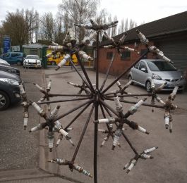 Spark plug seed head.: Click Here To View Larger Image